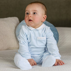 EMILE et ROSE Mason is another velour option for little boys but this time in a two piece. Mainly in soft pale blue velour the co-ordinating white collar and pocket edge are embroidered with blue and stone dashes. The cosy leggings have a gently elasticated waist and white feet with dash embroidery, simple, but smart.