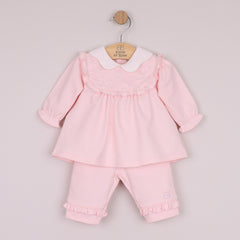 EMILE et ROSE Macey is a beautiful baby girls 2pc outfit in cosy Baby French Terry, the smock top has the same intricately embroidered, frilled inset yoke and pretty scalloped collar. On the trouser, the same frill from the yoke decorate each leg, very feminine!