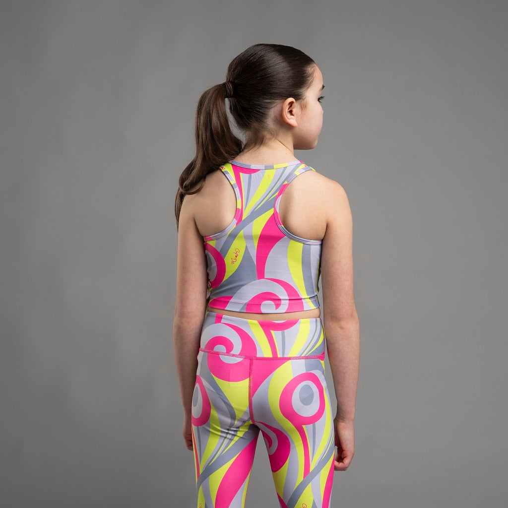 BONINI by ADee The Ignite Crop Top features a streamlined fit with a racerback design and bold swirl print for a vibrant, athletic look. Hot Pink