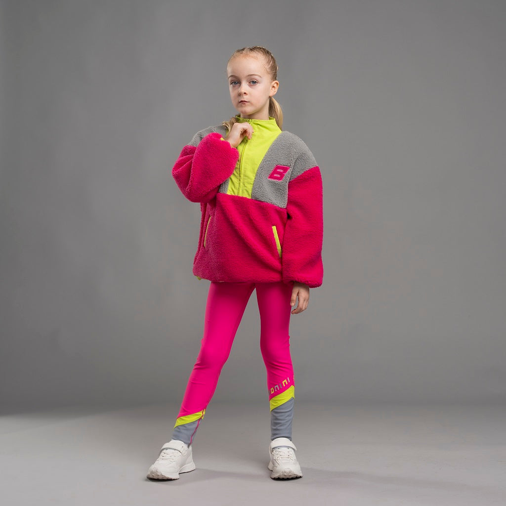 BONINI by ADee The Trail Sweatshirt features a relaxed, easy fit with a half-zip front and bold color-blocked design. Ideal for cozy comfort on the go. Hot Pink
