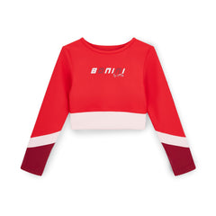 BONINI by ADee The Motion Crop Top features a cropped fit with long sleeves and bold contrast panels, delivering a sporty, standout look. Red