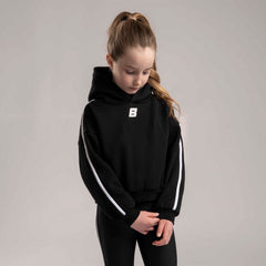BONINI by ADee The Revive Hoodie features a relaxed fit with a cropped silhouette. Finished with signature Bonini branding, it’s perfect for layering or pairing with matching pieces for an effortless everyday look. Black