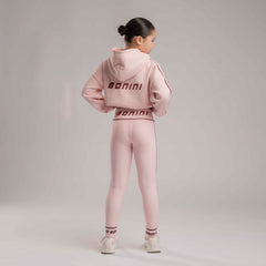 BONINI by ADee The Revive Hoodie features a relaxed fit with a cropped silhouette. Finished with signature Bonini branding, it’s perfect for layering or pairing with matching pieces for an effortless everyday look. Light Pink