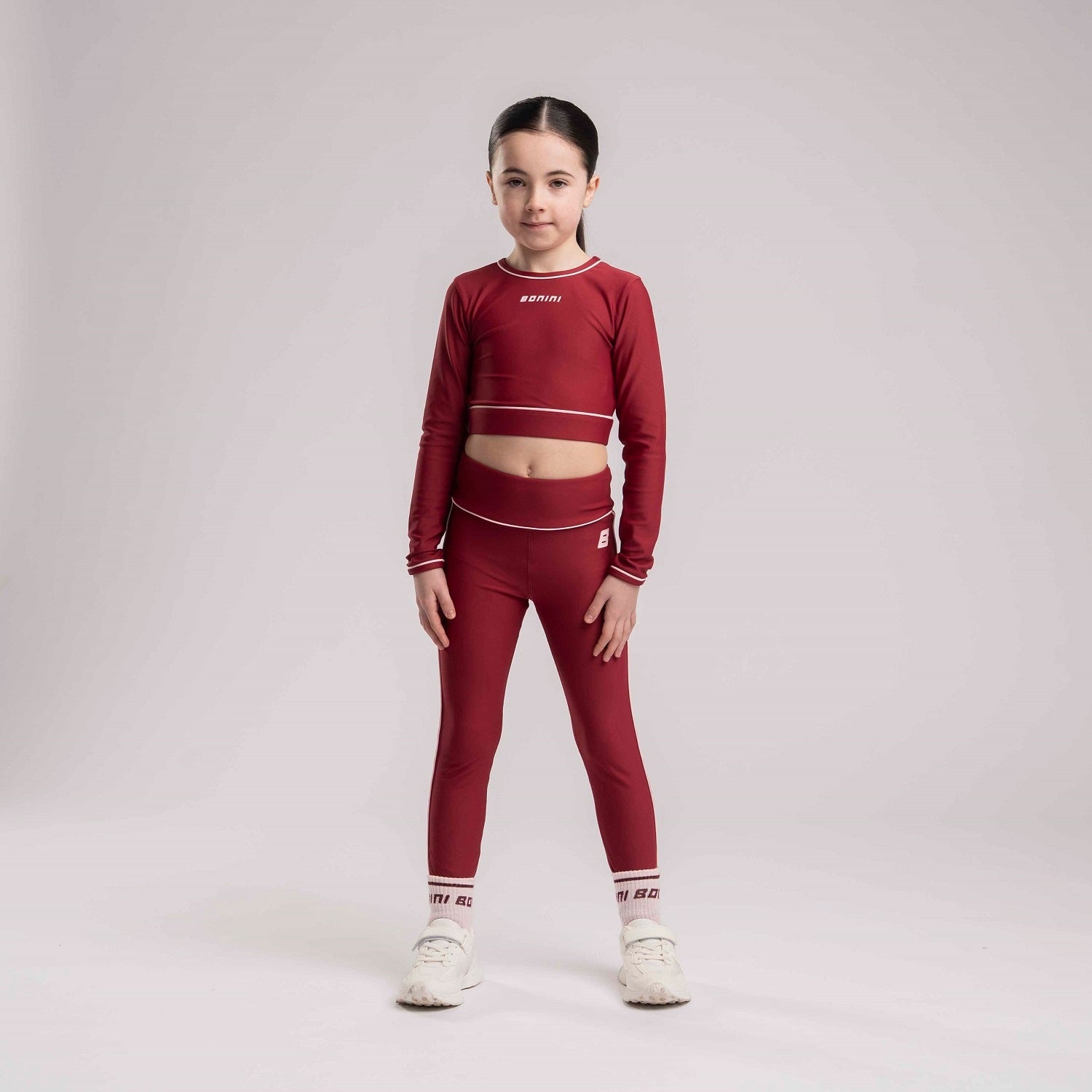 BONINI by ADee The Revive Long Sleeve Crop Top features a cropped fit with a comfortable feel. Finished with Bonini branding, it’s perfect for pairing with matching pieces. Burgundy