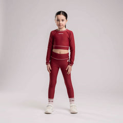 BONINI by ADee The Revive Long Sleeve Crop Top features a cropped fit with a comfortable feel. Finished with Bonini branding, it’s perfect for pairing with matching pieces. Burgundy