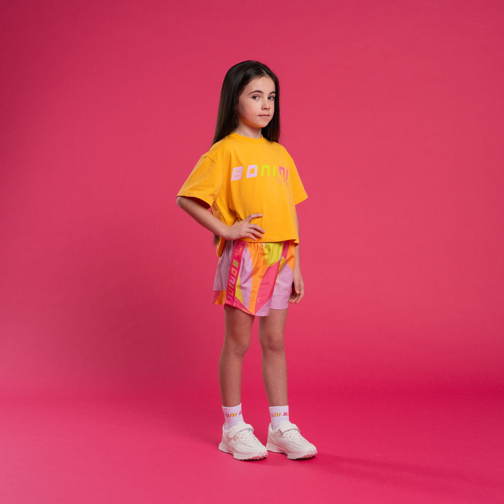 BONINI by ADee The Spark shorts are made in sikly all-over print poly with an elasticated waistband and logo taping down the sides. Hot Pink