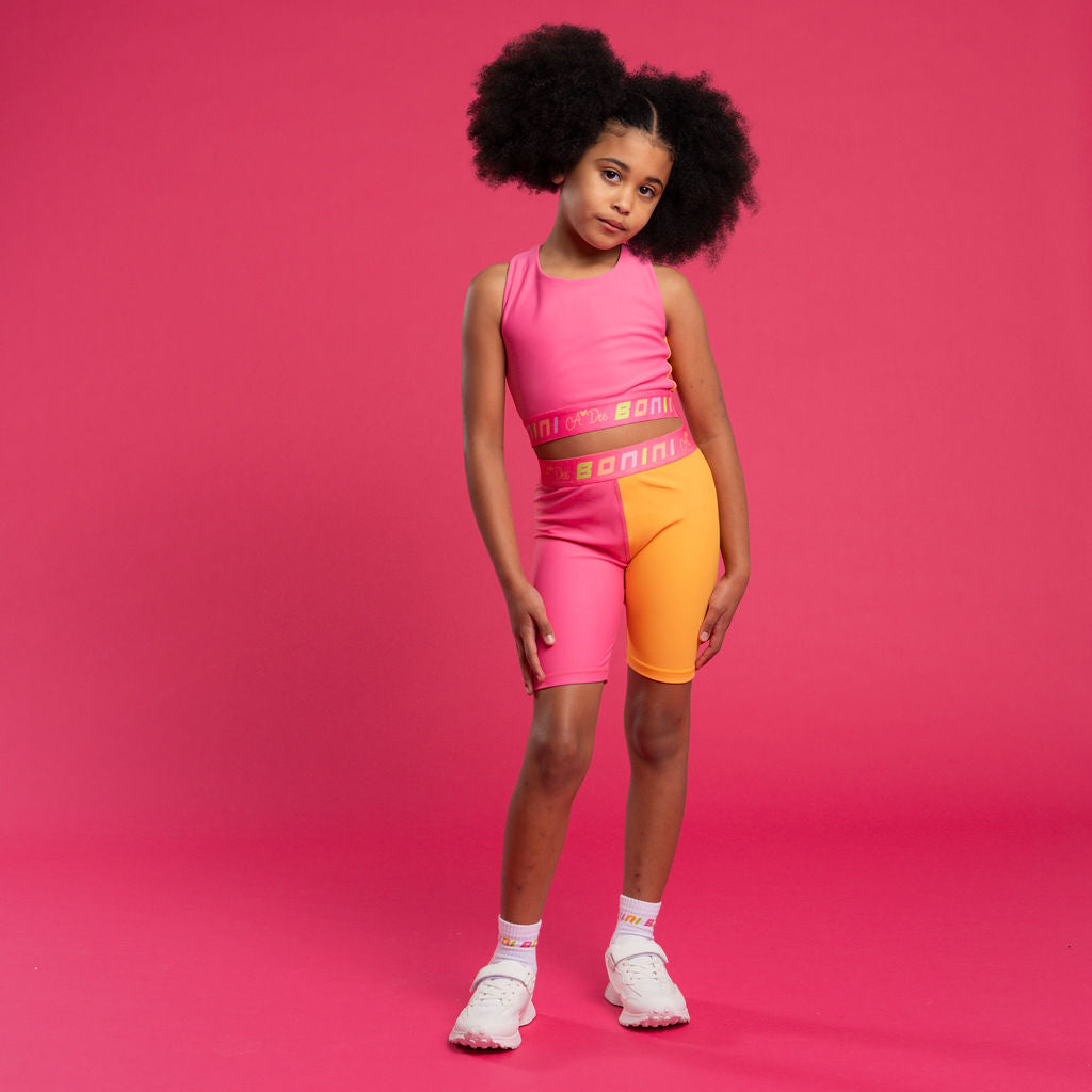 BONINI by ADee The Aspire Crop Top with a twist! Features a printed logo artwork on front and back has a cross over detail. Florida Orange