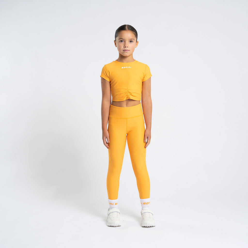 BONINI The Aspire Leggings feature their classic sport style and printed logo artwork on the back of the waistband. Florida Orange