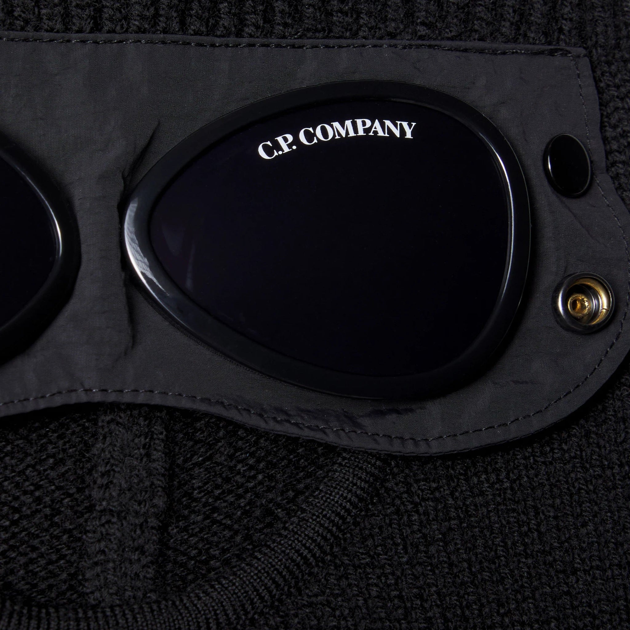 C.P. Company Kids' balaclava in black delivers warmth and protection with full-face coverage ideal for snowy play and cold weather outings. Crafted from soft wool. 