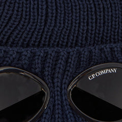 C.P. Company Kids Iconic goggle detail integrated into the turn-up brim. Dense ribbed wool creates structure and superior insulation. Adjustable turn-up brim for extra warmth. Premium construction built for daily winter wear. 100% Wool Hand wash. Navy
