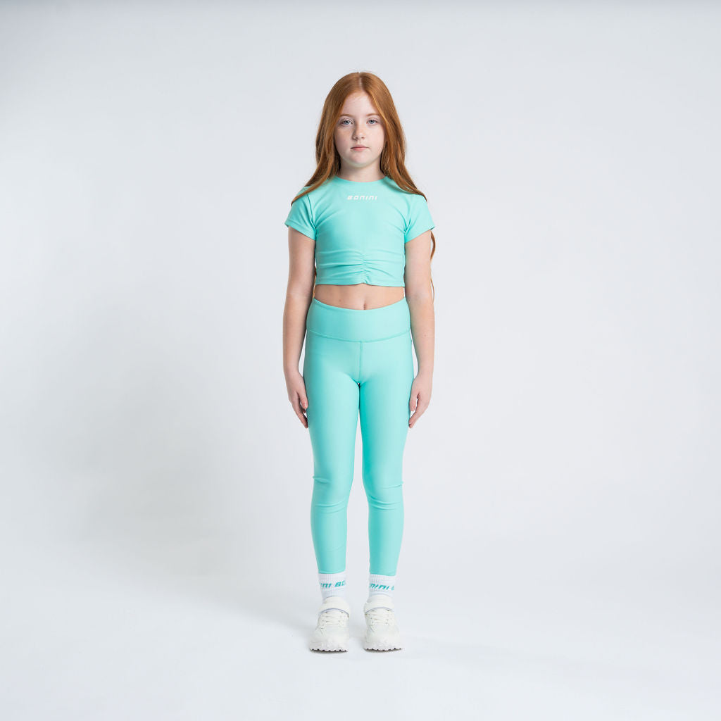 BONINI The Aspire Leggings feature their classic sport style and printed logo artwork on the back of the waistband. Bold Mint