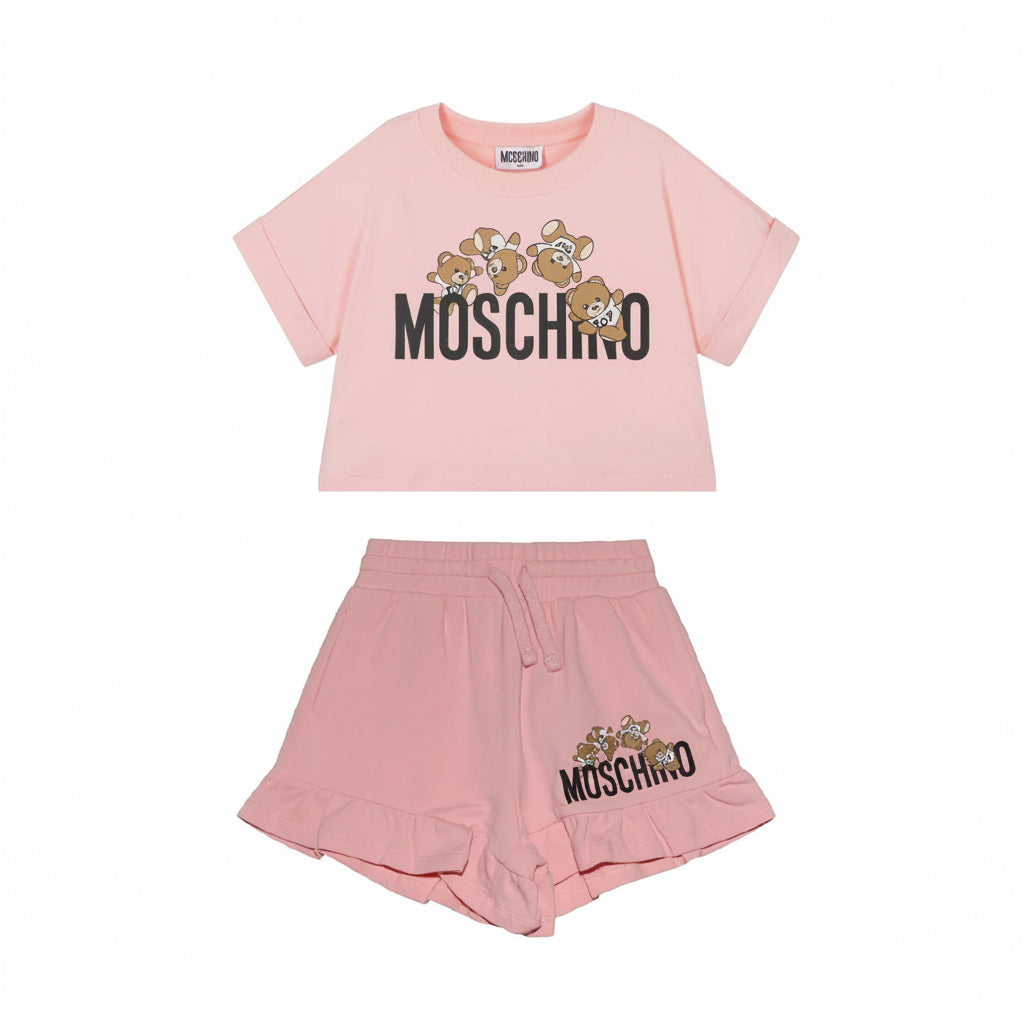 Moschino Girls cotton blend t-shirt paired with shorts featuring logo graphic print at the leg, teddy bear motif and ruffle cuffs, two side slit pockets and elasticated drawstring waistband. Sugar Pink