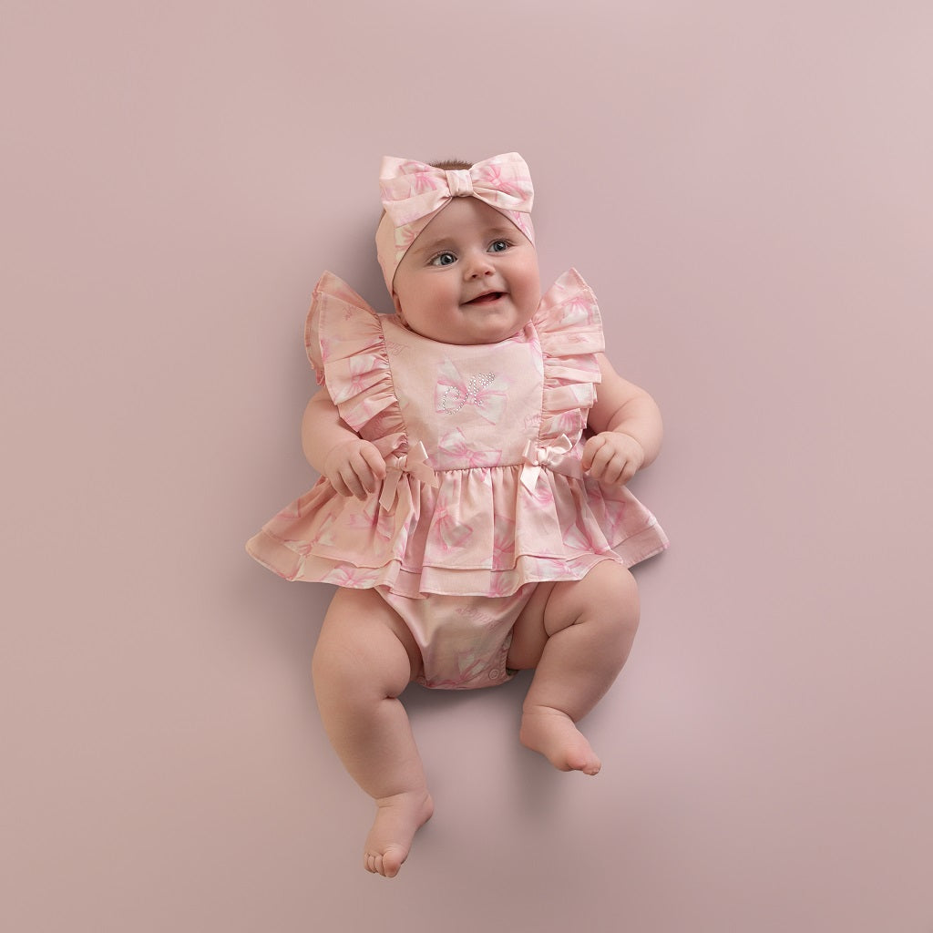 LITTLE A Perfectly Pink.&nbsp;The Odessa romper is made with cute all over bow print poplin, finished with frill and bow details finished with diamante branding. Pink Blossom