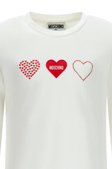 White T-shirt for girls by the luxury Italian designer Moschino. Made from soft cotton jersey, it features the heart print in red on the front. Designed with a ribbed neckline and short long sleeves for comfort and durability