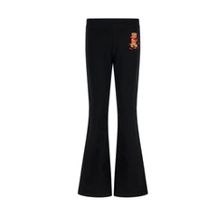 Black trousers for girls by the luxury Italian designer Moschino. Crafted from soft cotton with a touch of elastane, they showcase the brand's iconic Teddy Bear motif with red hearts and logo print on the front. The stylish flared hem and elasticated waistband deliver both comfort and contemporary style.&nbsp;