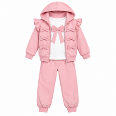 Georgio Bambini girls pink three-piece tracksuit with ruffle details, bow embellishments, and rhinestone accents. The set includes a hooded zip-up jacket and matching jogger pants.