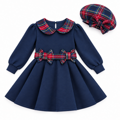 Girl navy blue dress with red, green, and yellow plaid collar and double bow waistband. Comes with matching plaid hat