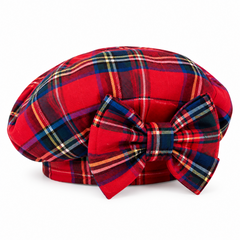 A red tartan plaid beret-style hat to match the dress.