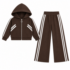 A girls two-piece tracksuit set in brown, featuring a zip-up hoodie with white diagonal stripes on the chest, paired with matching wide-leg pants with white side stripes.