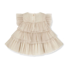 LITTLE A by ADee Little Locket theme. The Ella dress features layered tulle frills and flutter sleeves. Finished with a tiered skirt for a beautifully floaty, dressy look. Stone Beige