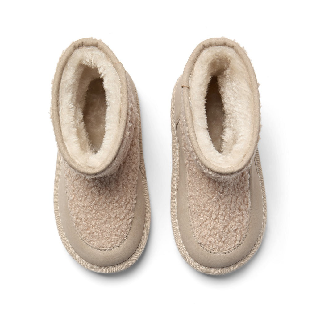 LITTLE A by ADee Introducing the Teddie boot in soft faux suede with a plush lining, chunky sole, and easy pull-on tab. Stone Beige.