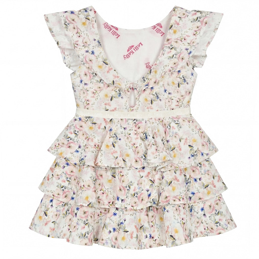 LELLI KELLY Aria Printed Ruffle Dress—a delightful blend of floral prints and elegant ruffles that captures attention and turns heads wherever she goes. Logo on waistband.