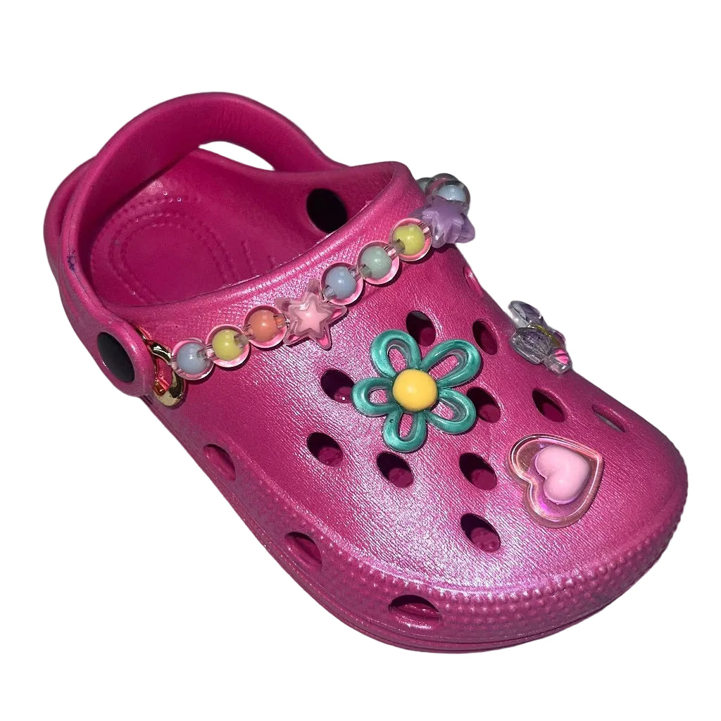 Sparkly fuchsia sandals with gorgeous gems! LELLI KELLY's Melody clogs are comfy and magical, perfect for kids who love to shine