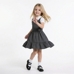 LELLI KELLY Becky Grey School Pinafore featuring a charming bow detail on the back and charm with LELLI KELLY logo on the front