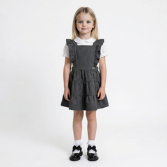 LELLI KELLY Bryony Grey Frill Pinafore featuring cross over strap detail on the back and charm with LELLI KELLY logo on the front