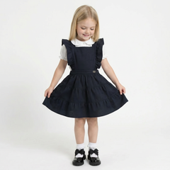 LELLI KELLY Bryony Navy Frill Pinafore featuring cross over strap detail on the back and charm with LELLI KELLY logo on the front