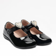 Lelli Kelly Sabrina comes in a black patent upper. Sabrina has a hook and loop fastening. A large cream diamante framed heart that changes colour in the sunlight sits on the strap fastening and this can be slid off and replaced with a bow. Pink Leather lining completes the look