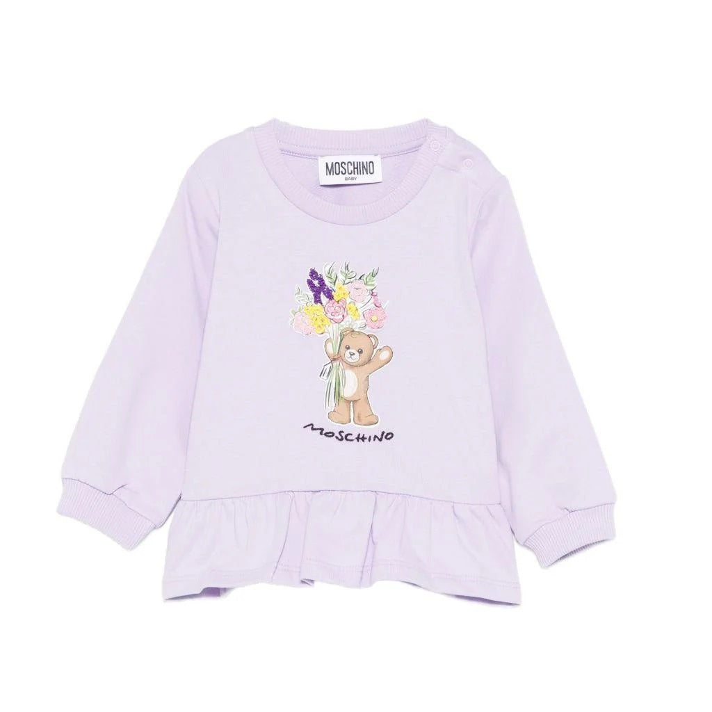 MOSCHINO baby girls sweatshirt in soft pastel lilac with charming teddy bear and floral detail.