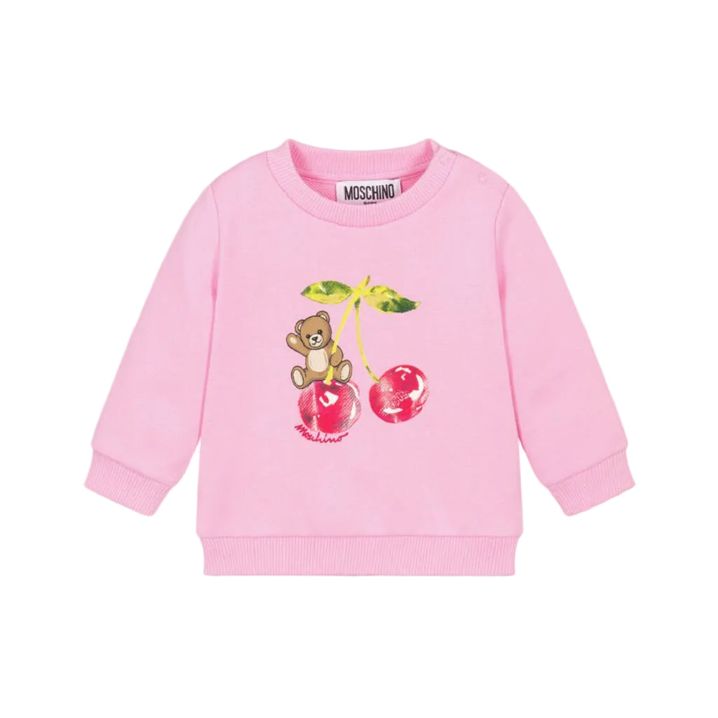 Pink cotton jersey sweatshirt by Moschino for baby girls, featuring a teddy bear and cherry motif with ribbed trims and shoulder poppers.