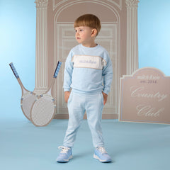 MITCH & SON Classic Collection. The Sean tracksuit features a colour block design a sweatshirt and matching joggers. Finished with ribbed trims and signature chest embroidery. Sky Blue