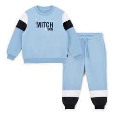 MITCH & SON Winter Chevron. The William tracksuit features a classic crewneck sweatshirt with bold front branding and matching joggers. Designed for everyday comfort with a clean, sporty feel. Cornflower Blue