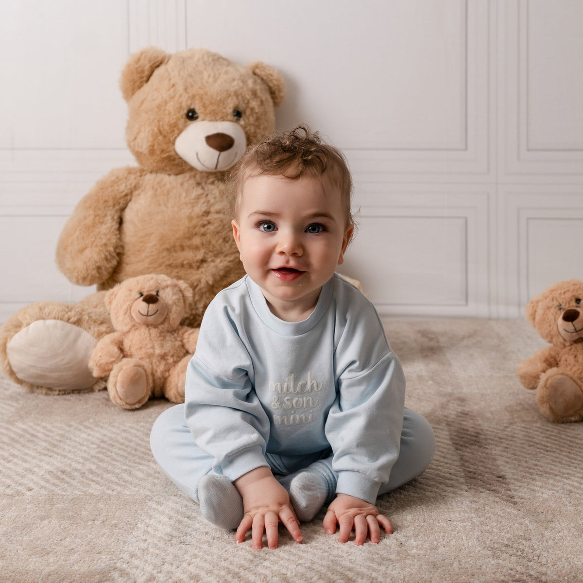 MITCH & SON Mini The Zander tracksuit pairs a soft sweatshirt with matching joggers, designed for all-day comfort. Finished with gentle trims and branding. Sky Blue