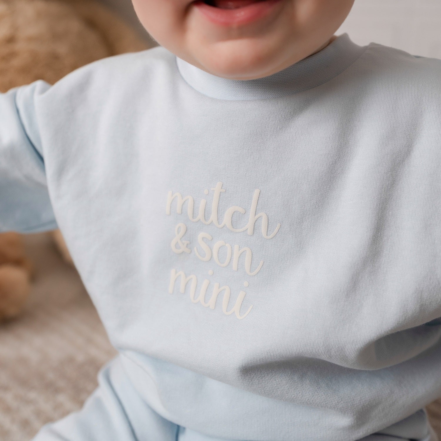 MITCH & SON Mini The Zander tracksuit pairs a soft sweatshirt with matching joggers, designed for all-day comfort. Finished with gentle trims and branding. Sky Blue
