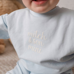 MITCH & SON Mini The Zander tracksuit pairs a soft sweatshirt with matching joggers, designed for all-day comfort. Finished with gentle trims and branding. Sky Blue
