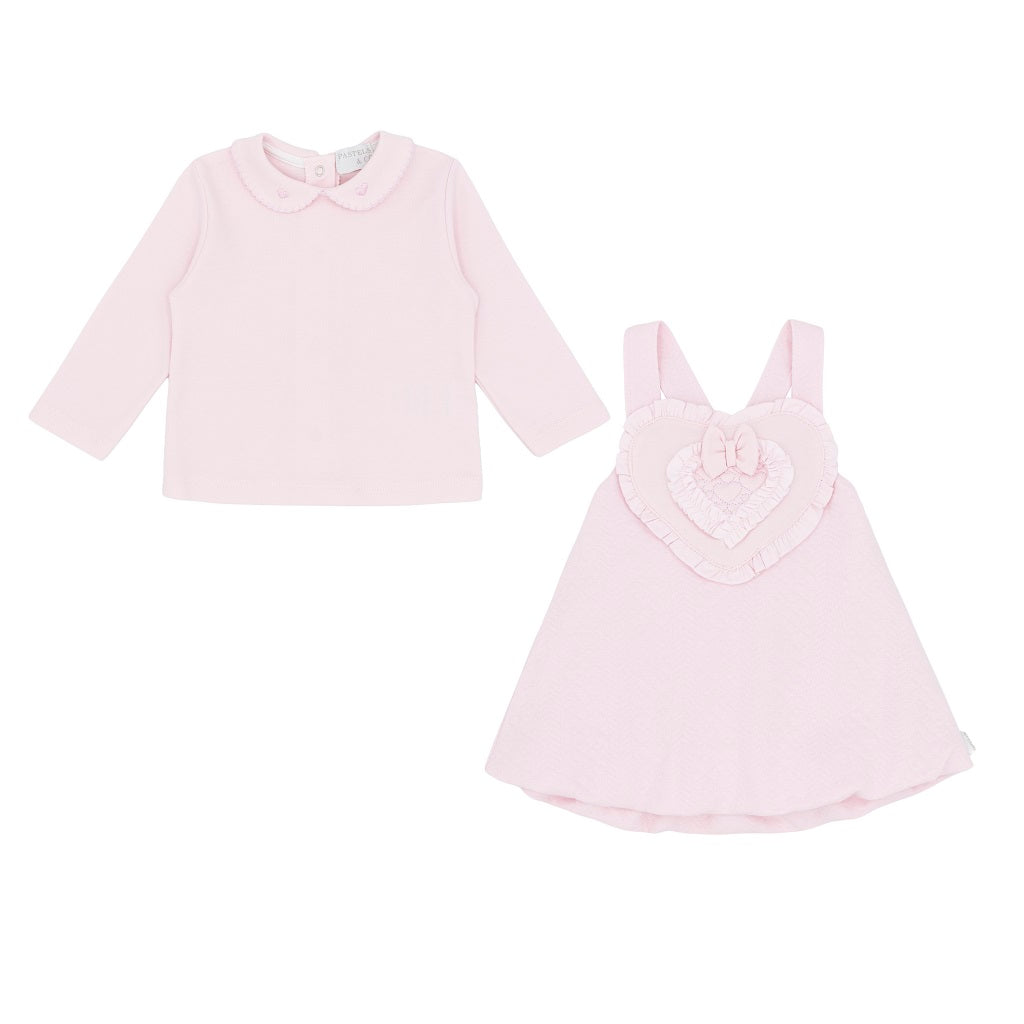 Pastels & Co - Hearts & Bows Story. The Mia puff ball dress in soft pale pink offers timeless elegance for baby girls.