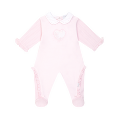Pale pink all-in-one by Pastels &amp; Co, elegantly designed with heart details and ruffled accents. A refined choice for baby girls.