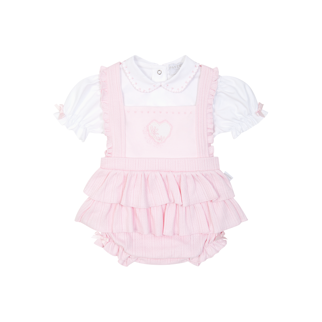 Adorable pale pink  dungaree set for baby girls featuring love heart detail with charming frills from Pastels &amp; Co. Perfect for playtime or special occasions!