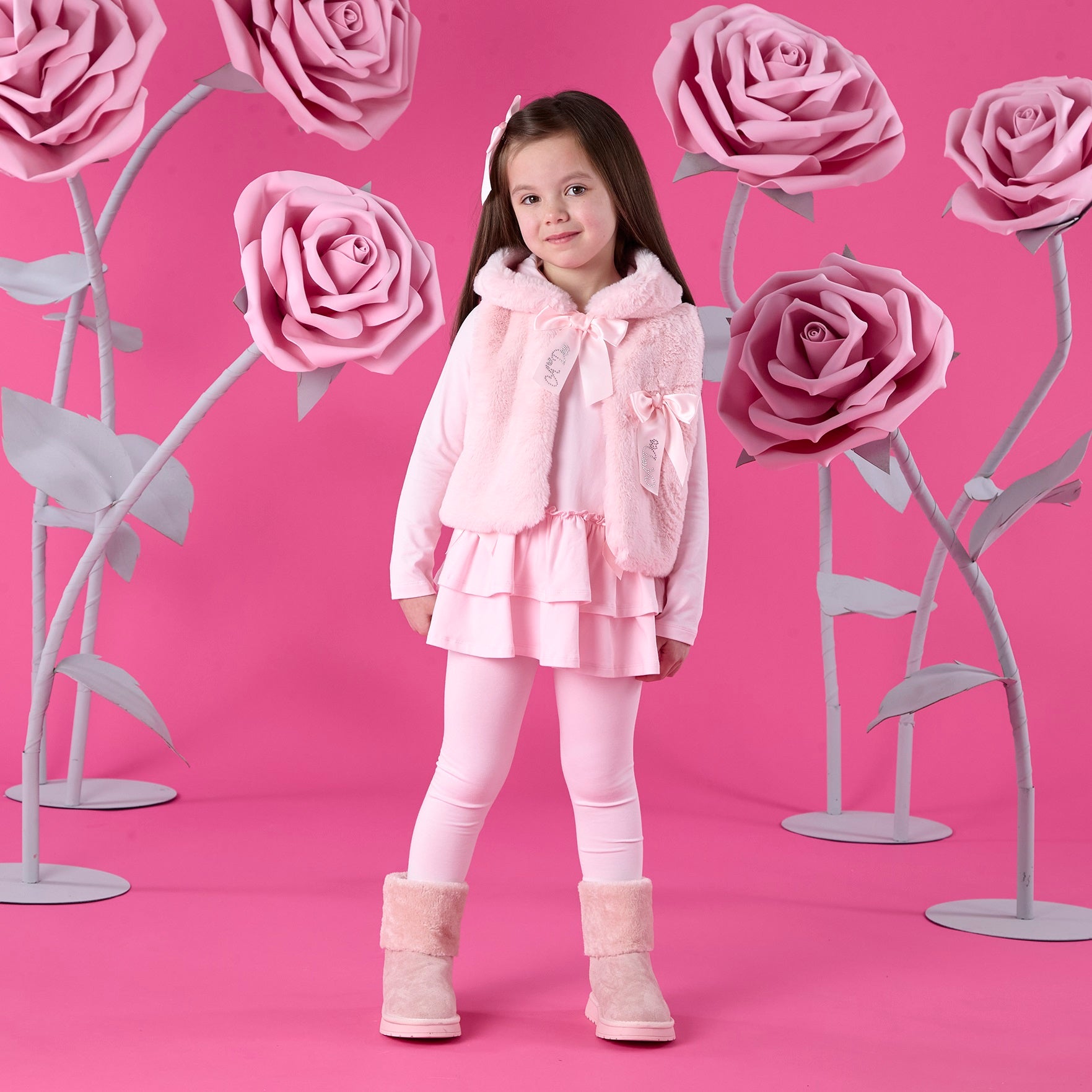 ADEE Winter Bloom Collection. The Ana Faux Fur Gilet comes in a gorgeous pink shade, finished with a beautiful appliqué bow on the chest. Pale Pink