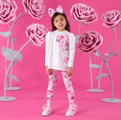 ADEE Winter Bloom Collection. The Ayla Set features a white tunic top with beautiful rose artwork on the front and a contrast printed back insert with bow detail. Paired with matching rose-print leggings to complete the look.