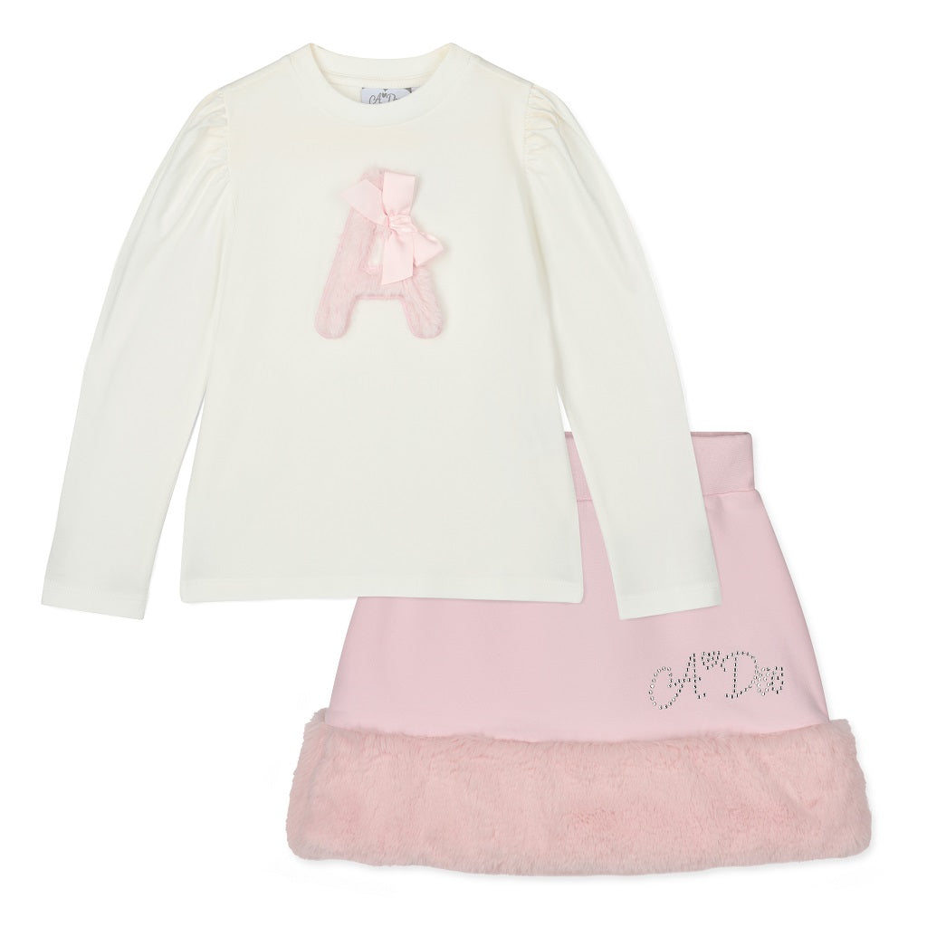 ADEE Winter Bloom Collection. The Andrea Set features a long-sleeved top with gorgeous faux fur “A” artwork on the front, paired perfectly with a pink skirt finished with soft faux fur trim. 