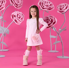 ADEE Winter Bloom Collection. The Alyssa dress features a faux fur applique handbag artwork, finished with a classic A*Dee diamantélogo. Pale Pink