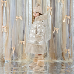ADEE Eau-de Adee Collection. Introducing the Aurora Jacket, a beautiful fit-and-flare style, finished with soft faux fur trims at the hood, cuffs, and hem. The cosy fleece lining and hood keep you warm, while signature details include a branded badge, logo zip pull, and sweet bows on each arm. Stone Beige