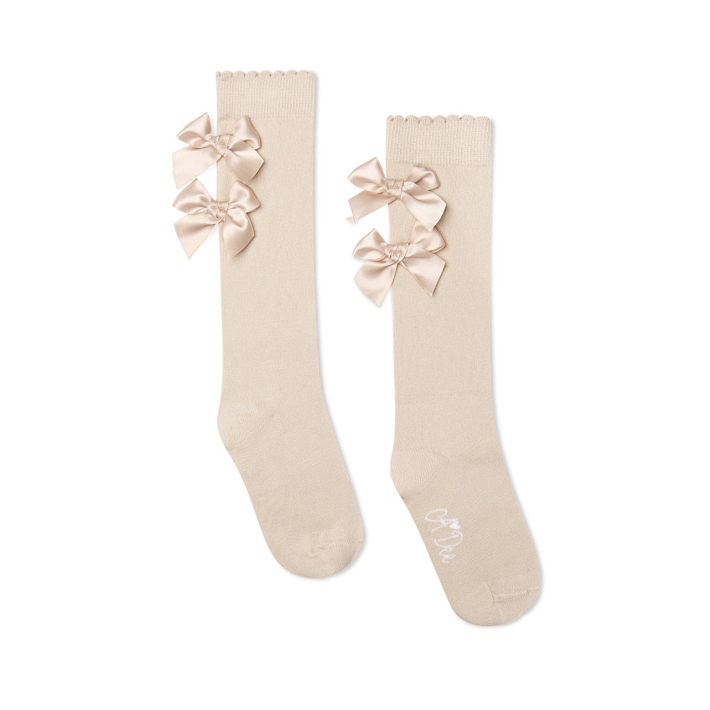 ADEE Eau de Adee Collection. A cute finishing touch, the Ariel knee-high socks are detailed with two sweet appliqué bows at the ankle. Stone Beige