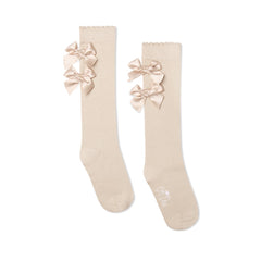 ADEE Eau de Adee Collection. A cute finishing touch, the Ariel knee-high socks are detailed with two sweet appliqué bows at the ankle. Stone Beige