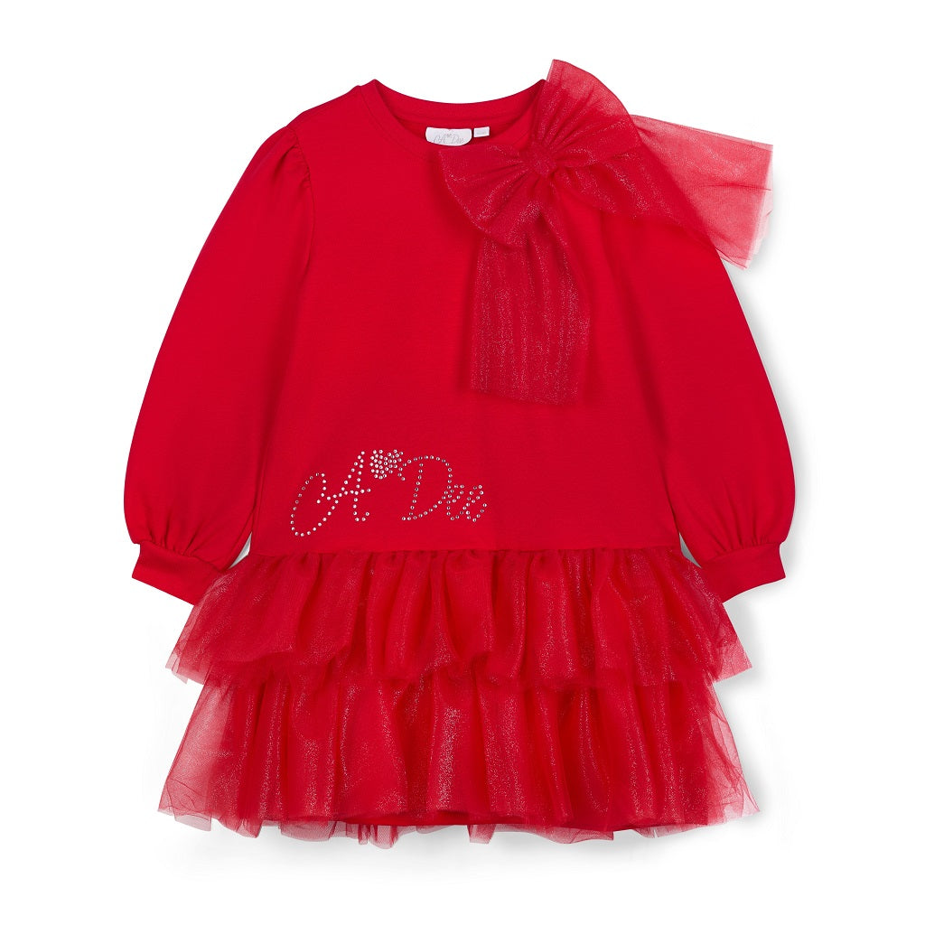 ADee The Brandy Dress features a glitter tulle double-frill skirt, long puff sleeves, and a statement appliqué bow. Perfect for festive Christmas parties. Red