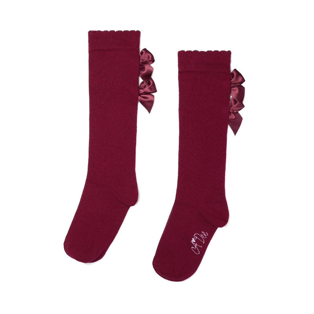 ADEE Chevron Charm Collection. A cute finishing touch, the Ariel knee-high socks are detailed with two sweet appliqué bows at the ankle. Deep Cherry